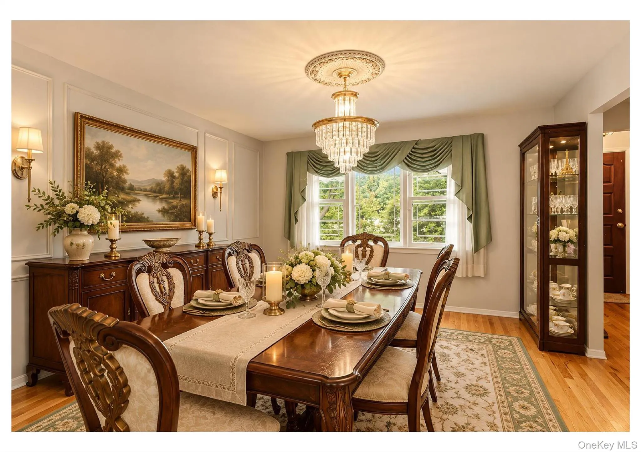 Formal dining space featuring hardwood flooring, wainscoting, and a chandelier with a decorative medallion Formal dining space featuring hardwood flooring, wainscoting, and a chandelier with a decorative medallion