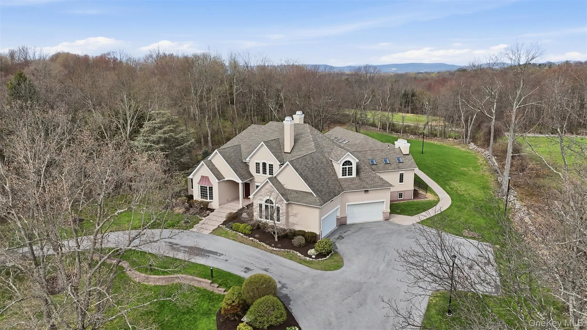 The property features an extensive driveway, a well-maintained lawn, and mature trees The property features an extensive driveway, a well-maintained lawn, and mature trees