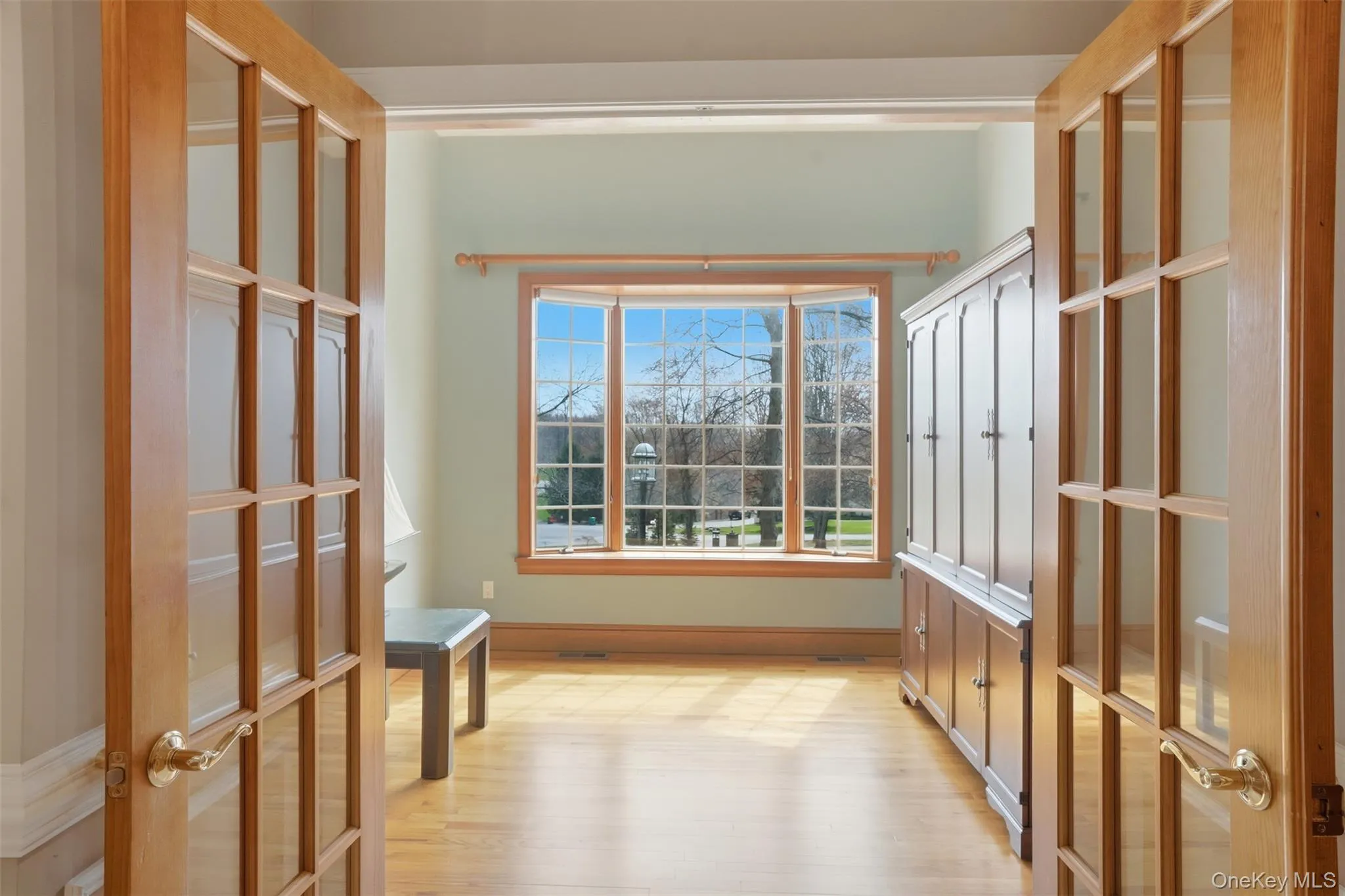 This room features hardwood floors and a large bay window providing abundant natural light This room features hardwood floors and a large bay window providing abundant natural light