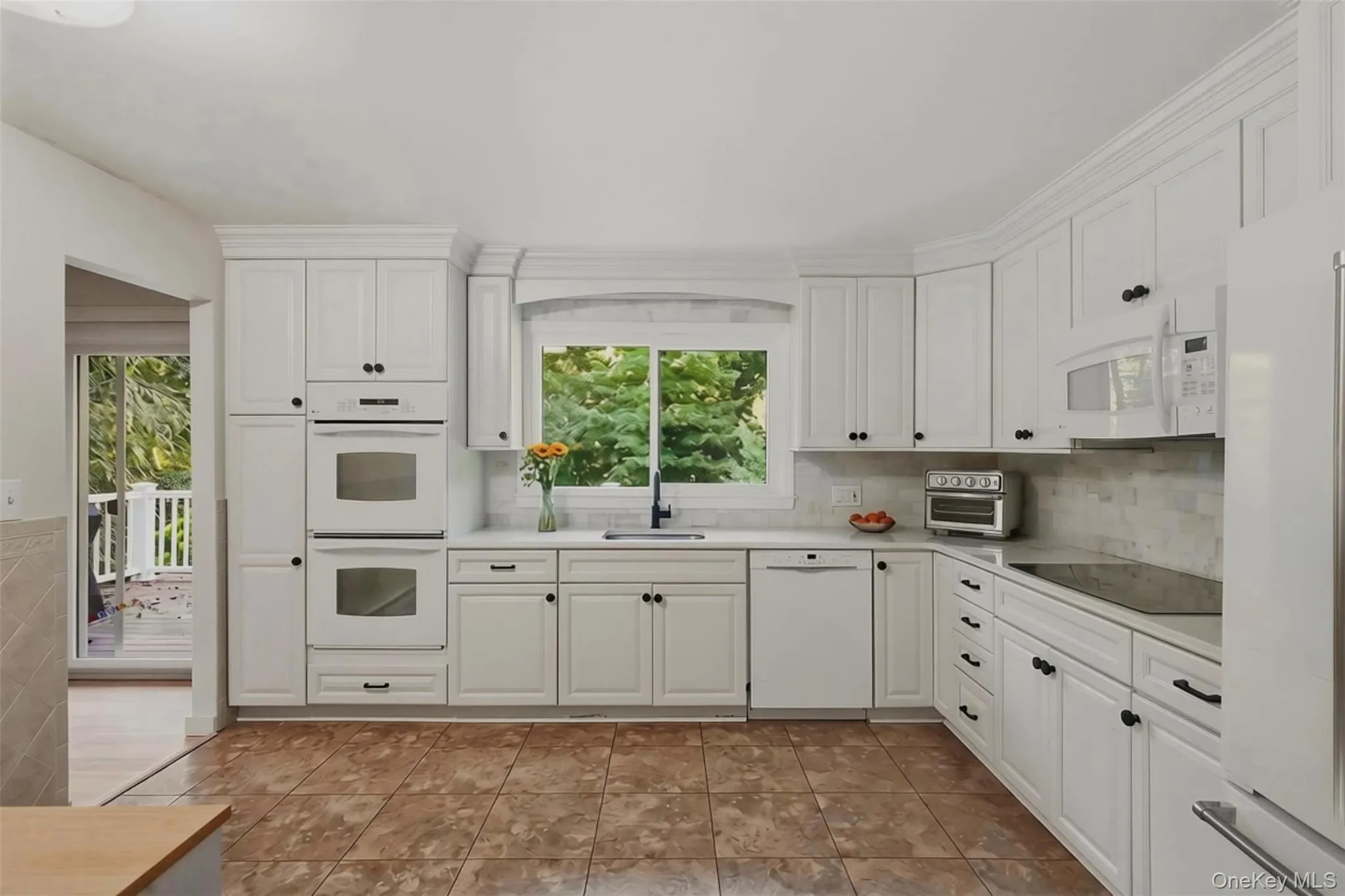 Kitchen with access to sliding doors to porch Kitchen with access to sliding doors to porch