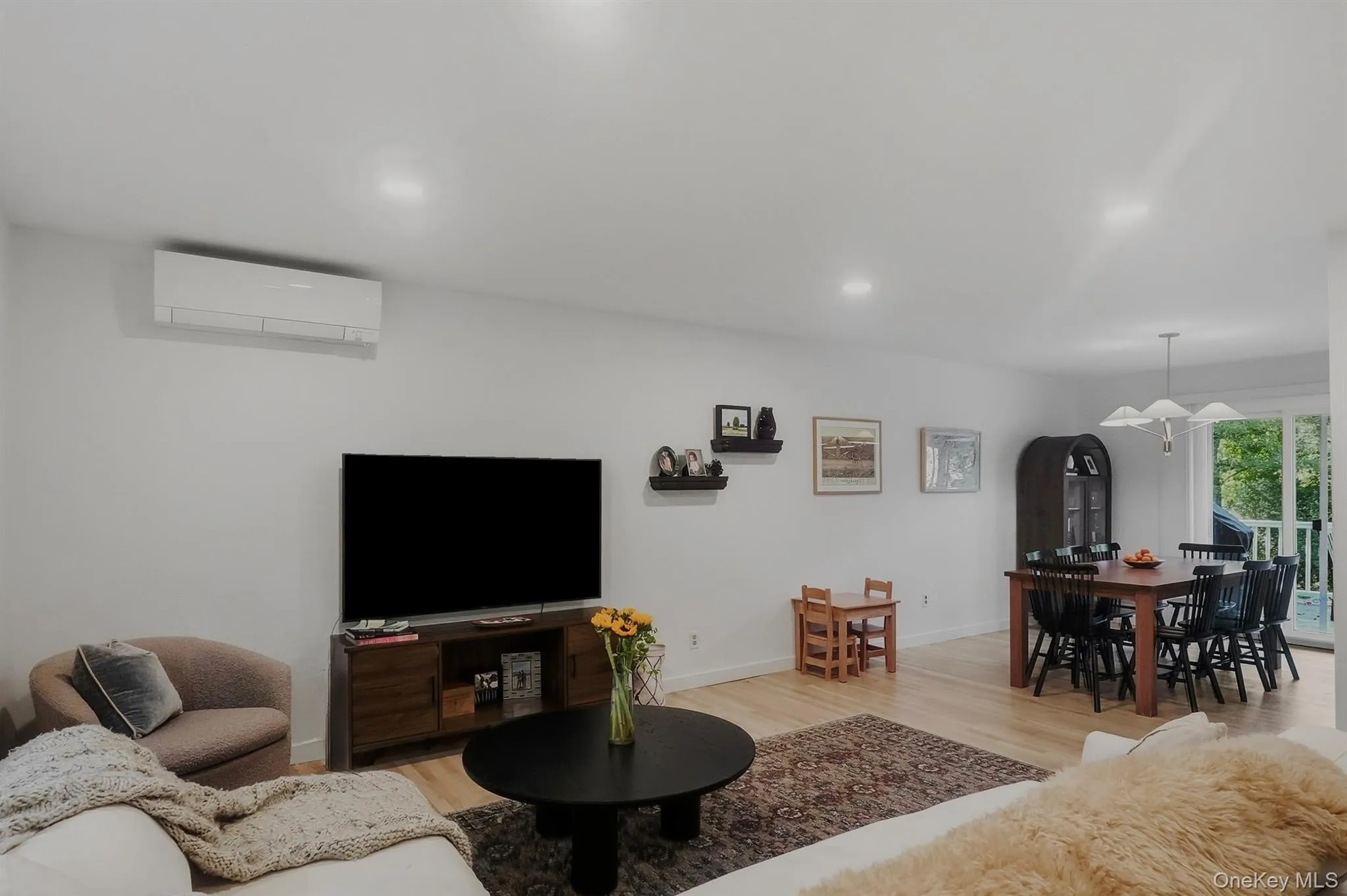 Family room with access to dining area and sliding doors to porch Family room with access to dining area and sliding doors to porch