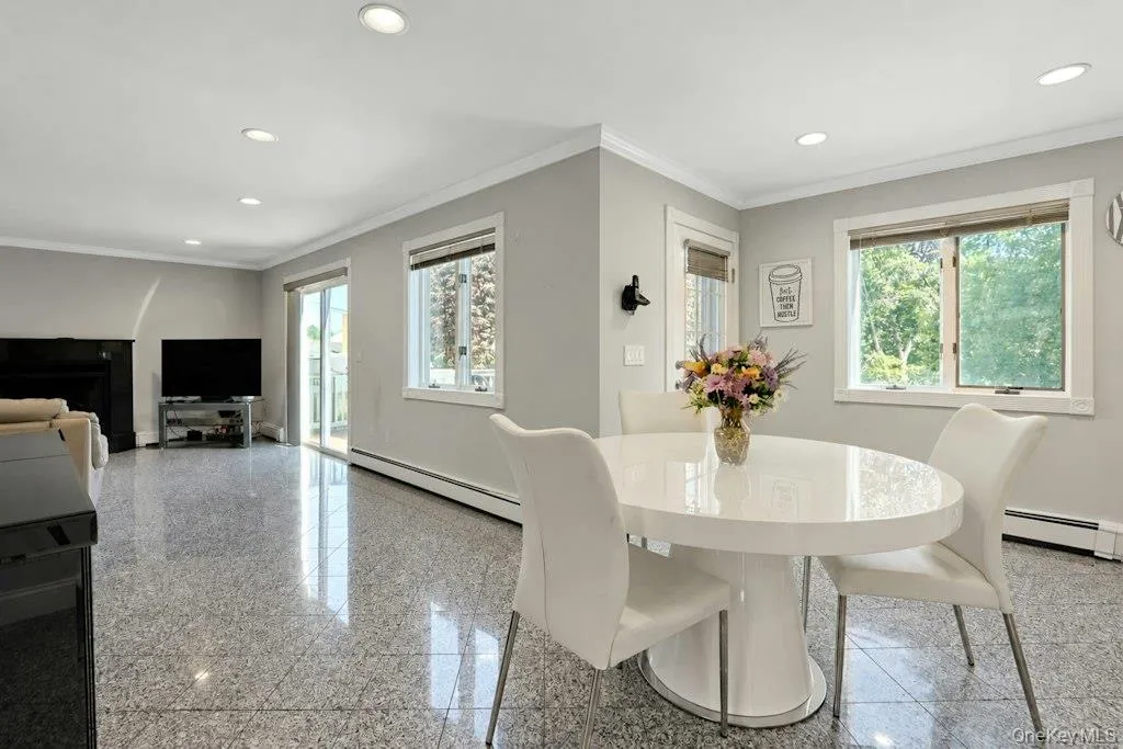 Eat-in kitchen opens to family room with door to deck plus sliders Eat-in kitchen opens to family room with door to deck plus sliders
