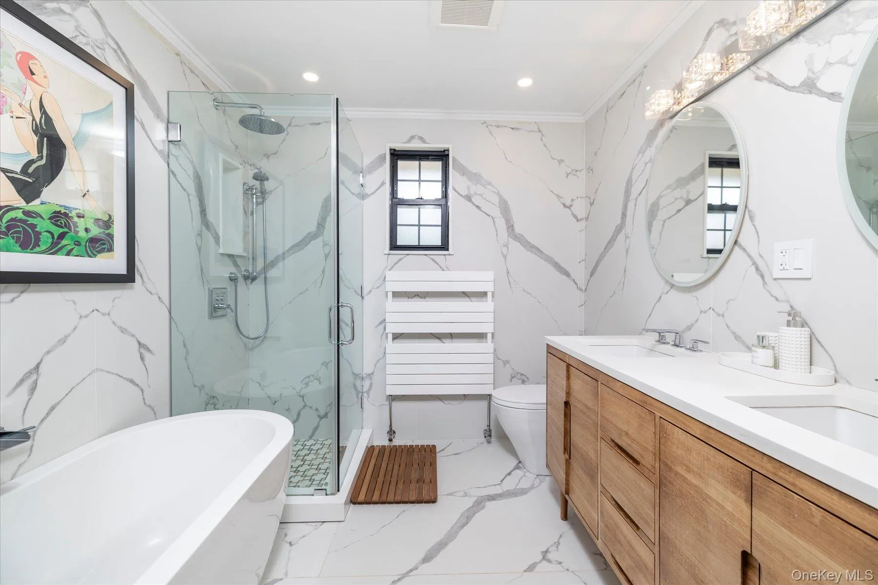 Bathroom with a freestanding tub and glass enclosed shower Bathroom with a freestanding tub and glass enclosed shower