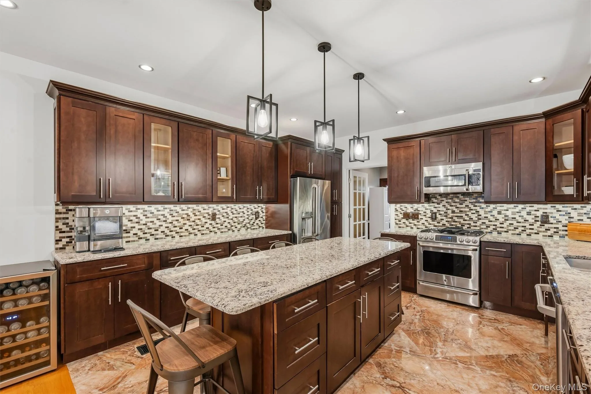Kitchen with 7 foot 7 inch center island that seats 6, Anderson casement window above sink, Cafe appliances, granite countertops, tile backsplash, uplighting, Recessed lighting, marble tile floors and 9 foot ceilings. Kitchen with 7 foot 7 inch center island that seats 6, Anderson casement window above sink, Cafe appliances, granite countertops, tile backsplash, uplighting, Recessed lighting, marble tile floors and 9 foot ceilings.