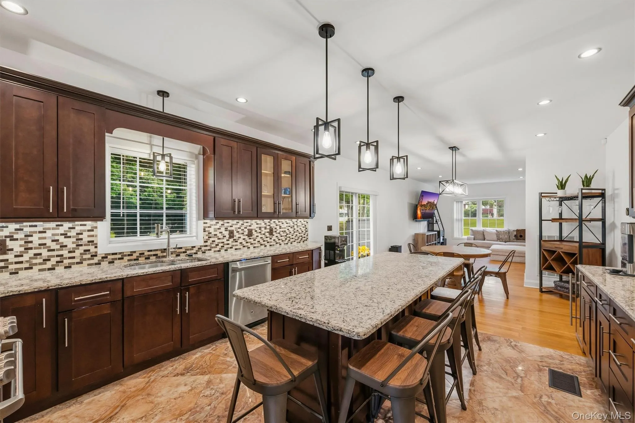 Kitchen with 7 foot 7 inch center island that seats 6, Anderson casement window above sink, Cafe appliances, granite countertops, tile backsplash, uplighting, Recessed lighting, marble tile floors and 9 foot ceilings. Kitchen with 7 foot 7 inch center island that seats 6, Anderson casement window above sink, Cafe appliances, granite countertops, tile backsplash, uplighting, Recessed lighting, marble tile floors and 9 foot ceilings.