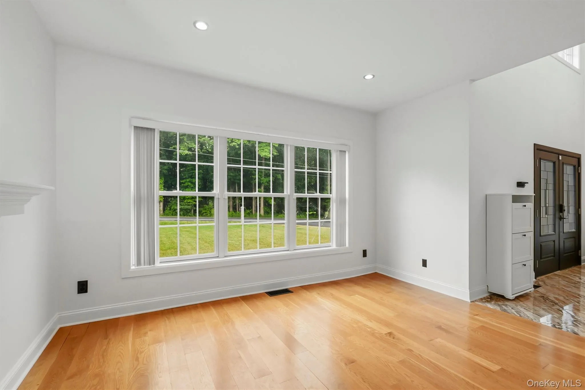 Formal living room, recessed lighting, wide plank white oak flooring, Anderson windows and 9 foot ceilings. Formal living room, recessed lighting, wide plank white oak flooring, Anderson windows and 9 foot ceilings.