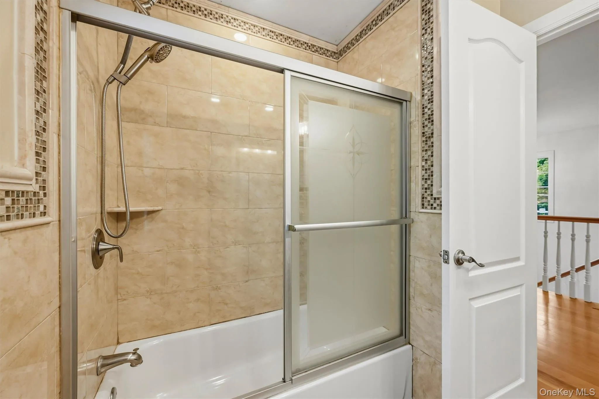Hallway bathroom, marble tile, Anderson window, recessed lighting. Hallway bathroom, marble tile, Anderson window, recessed lighting.