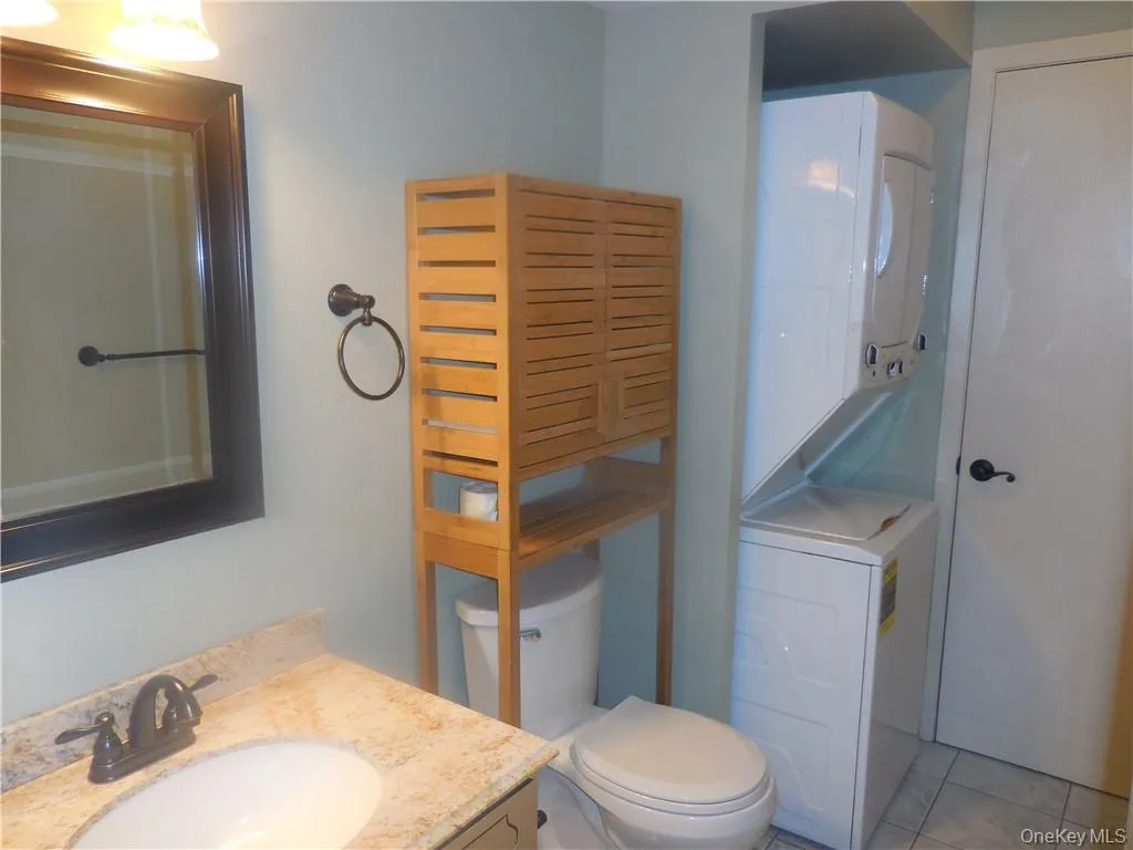 Combination laundry room with half bathroom. Combination laundry room with half bathroom.