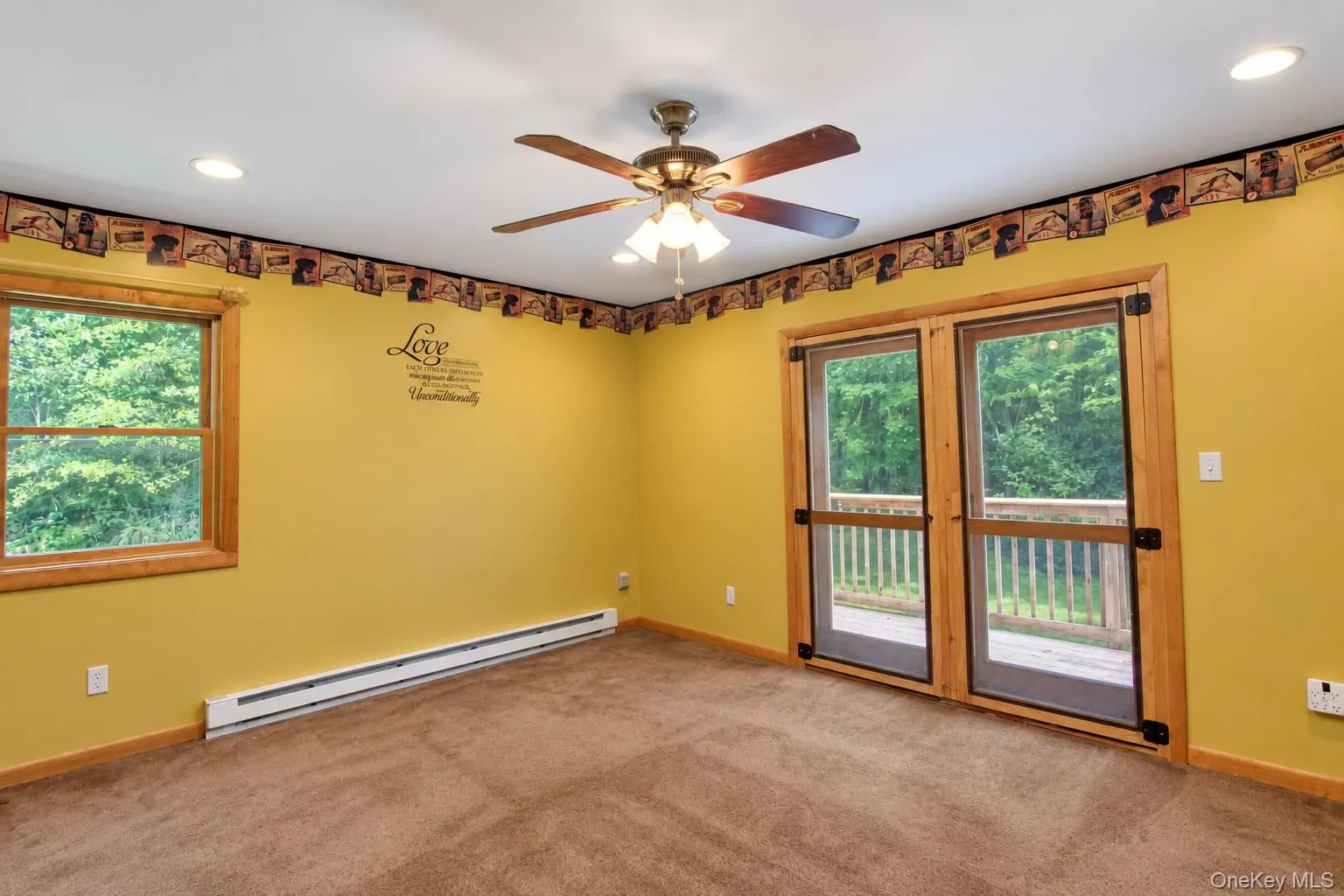 Recessed lighting, ceiling fan, wood-frame window, and glass-paneled double doors providing exterior access Recessed lighting, ceiling fan, wood-frame window, and glass-paneled double doors providing exterior access
