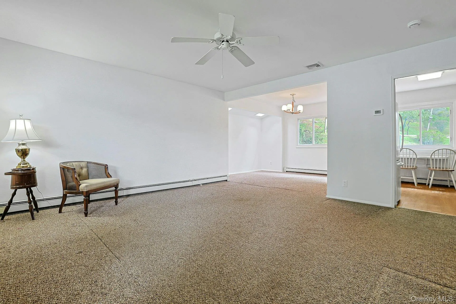 View of living room, kitchen and dining room. View of living room, kitchen and dining room.