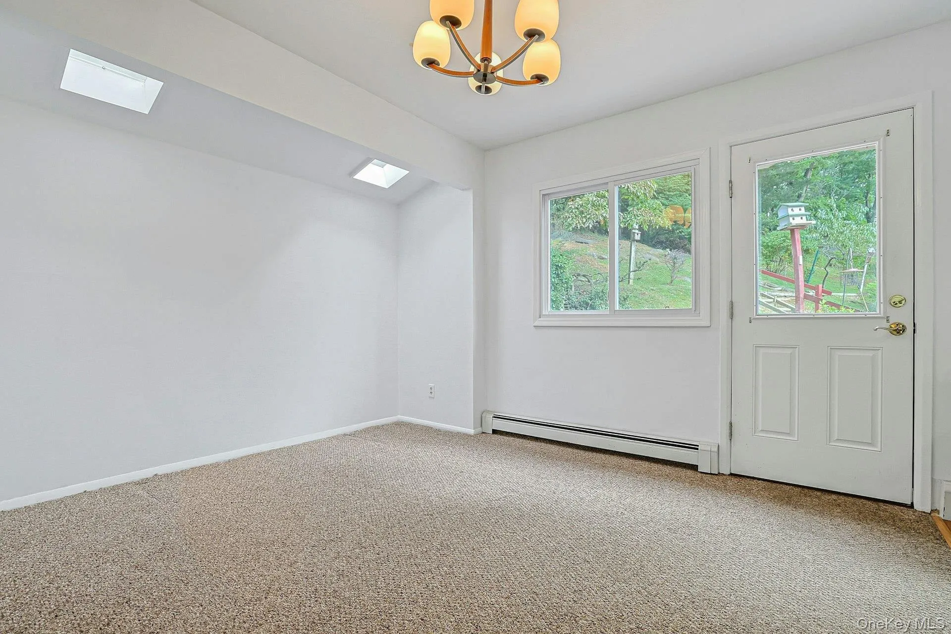 Dining are with two skylights. Dining are with two skylights.