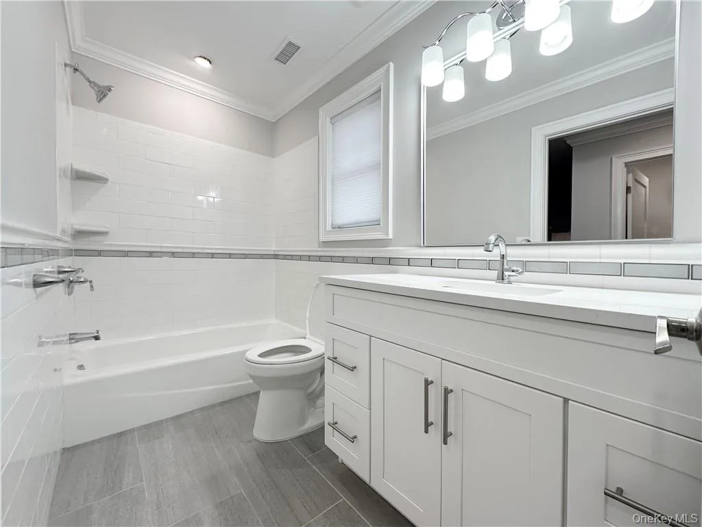Full bathroom up a half flight from living space. Full bathroom up a half flight from living space.