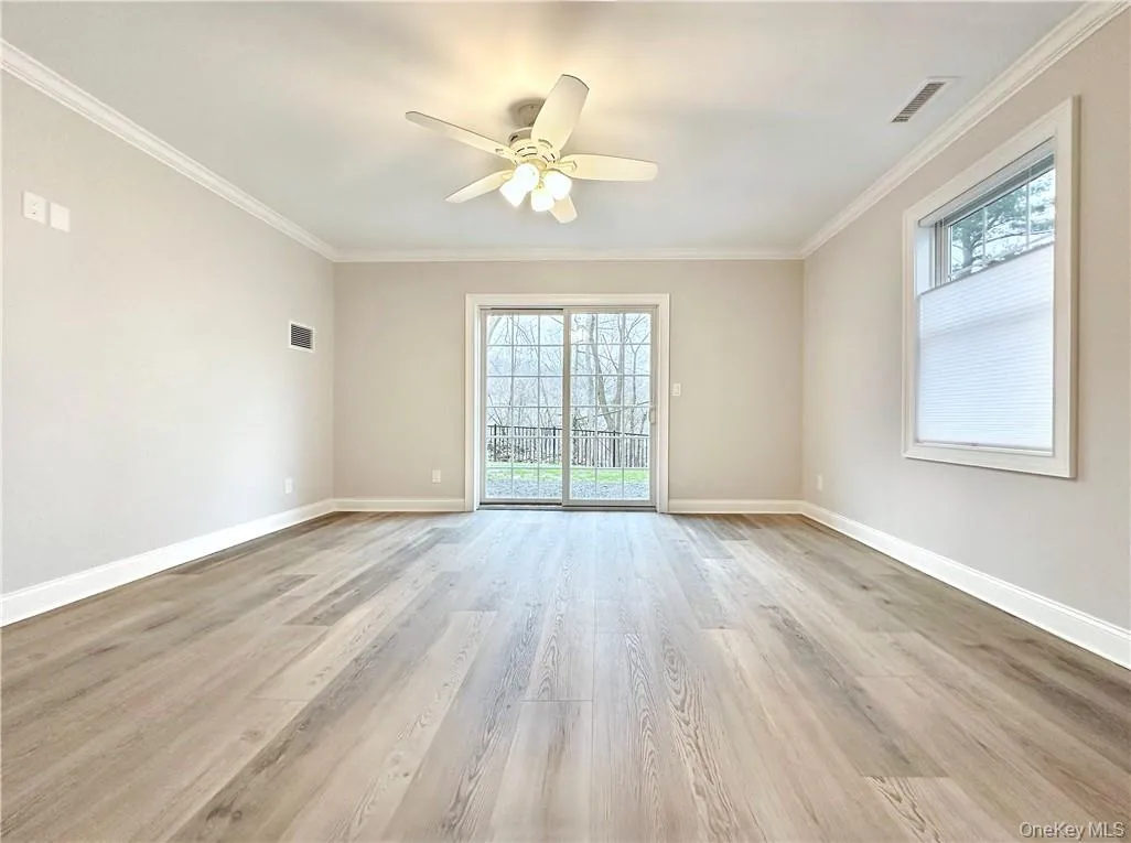 Entry level family room with sliders to patio. Entry level family room with sliders to patio.