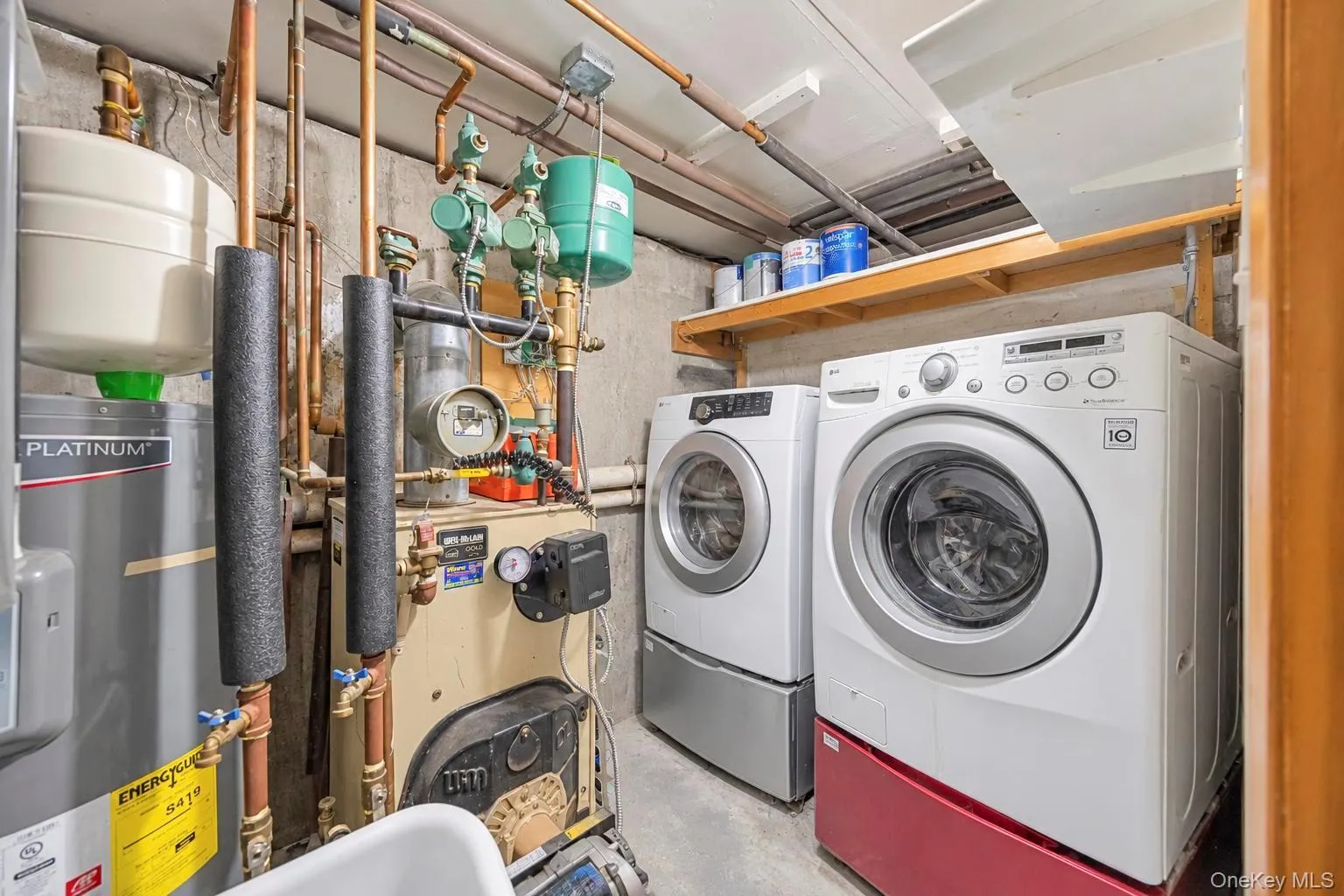 Built-in shelving, two front-load washers, hot water heater, and mechanical systems Built-in shelving, two front-load washers, hot water heater, and mechanical systems