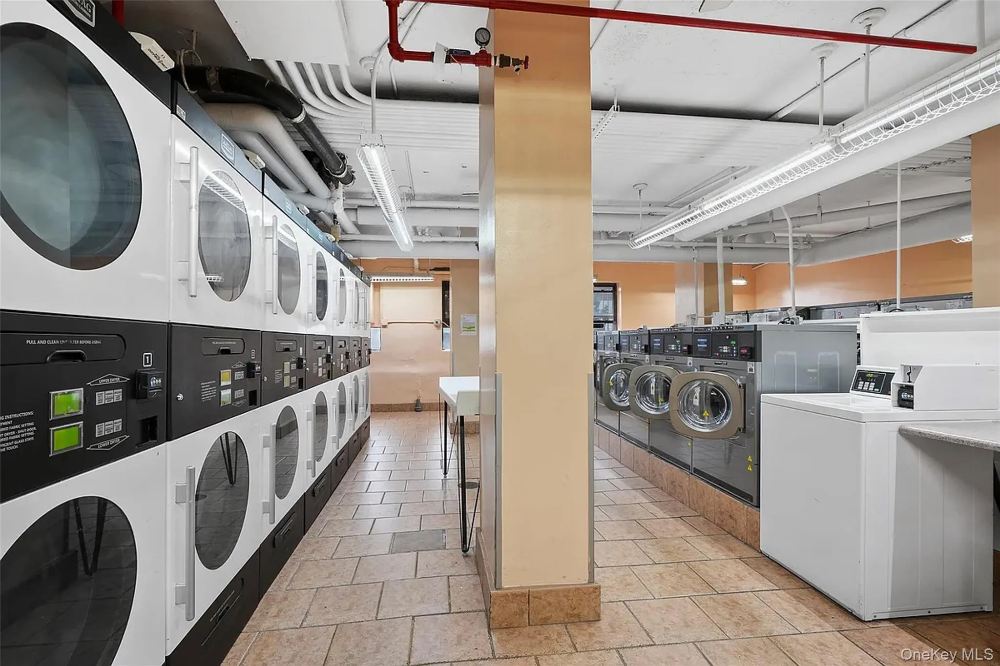 Dedicated laundry facility featuring multiple commercial-grade washers and dryers Dedicated laundry facility featuring multiple commercial-grade washers and dryers