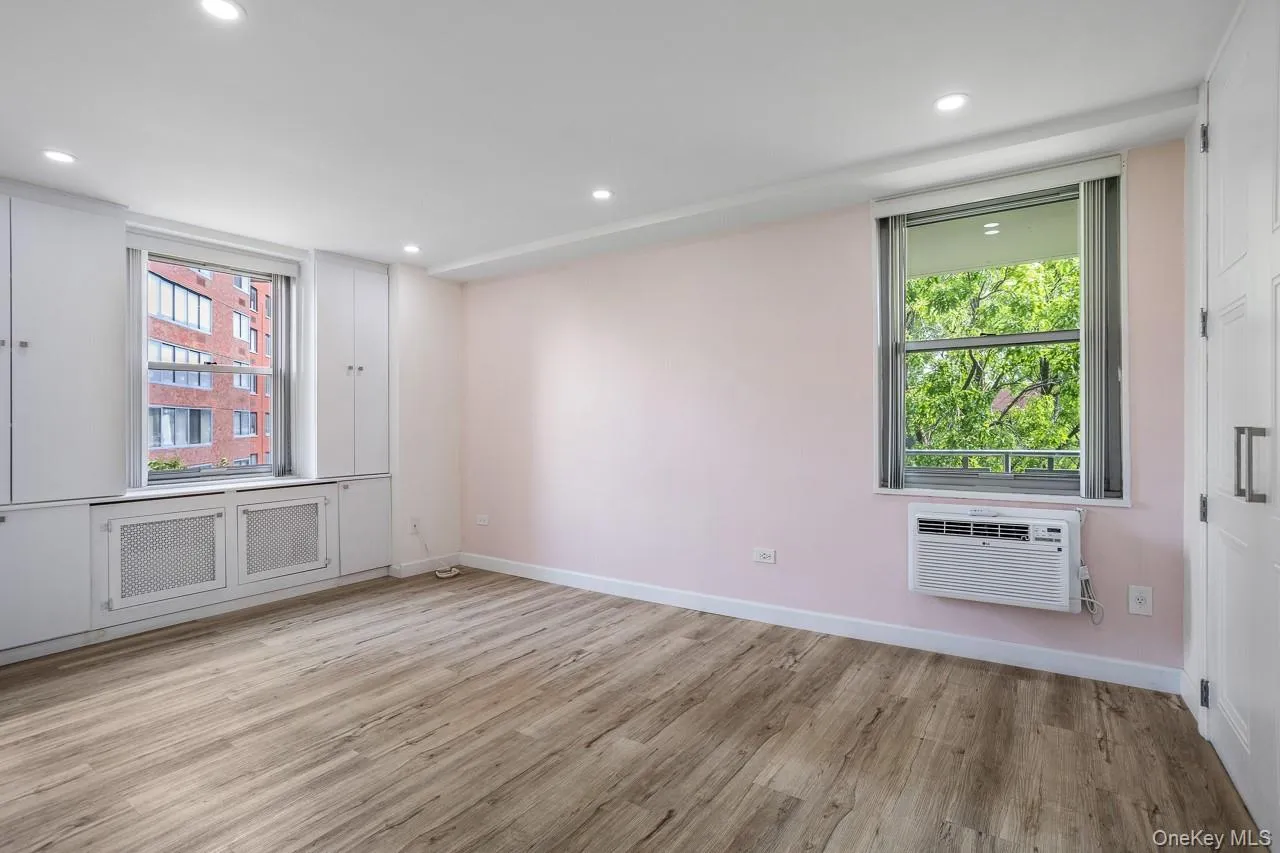 Recessed lighting illuminates wood-finish flooring Recessed lighting illuminates wood-finish flooring