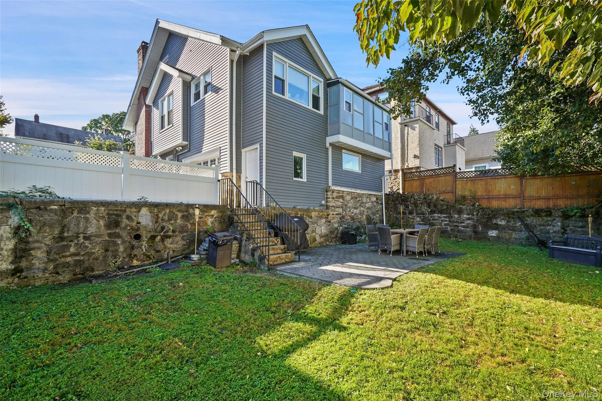 Large, fenced in yard with plenty of space to entertain, grill and play Large, fenced in yard with plenty of space to entertain, grill and play