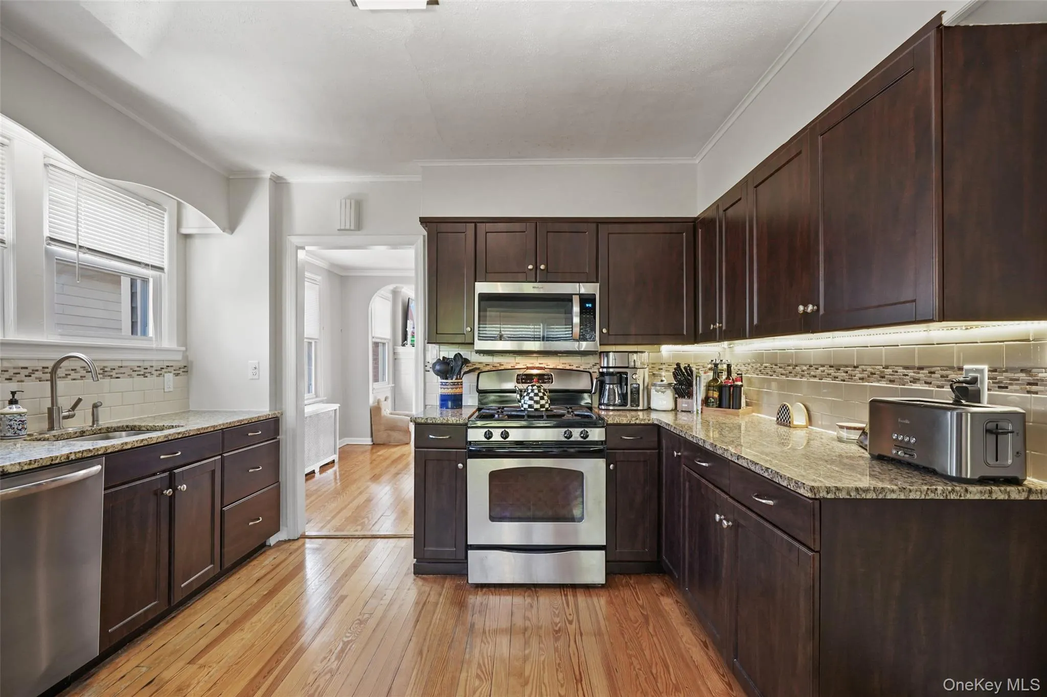 Updated kitchen with stainless steel appliances and plenty of space for cooking and storage. Updated kitchen with stainless steel appliances and plenty of space for cooking and storage.