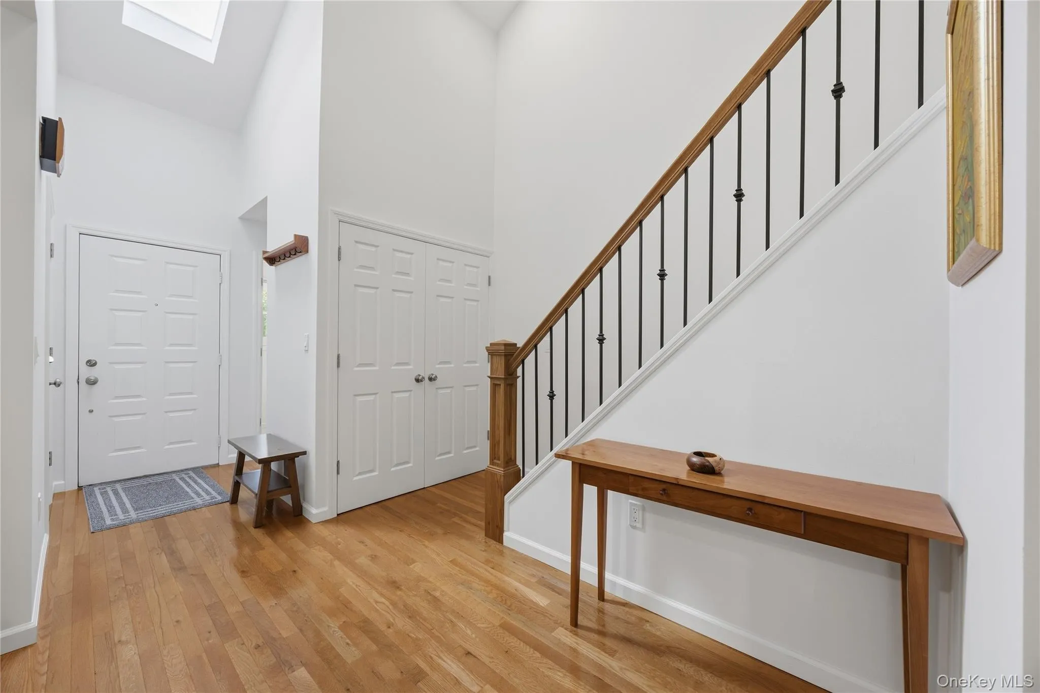 Bright Entry Foyer with coat closet and skylight Bright Entry Foyer with coat closet and skylight