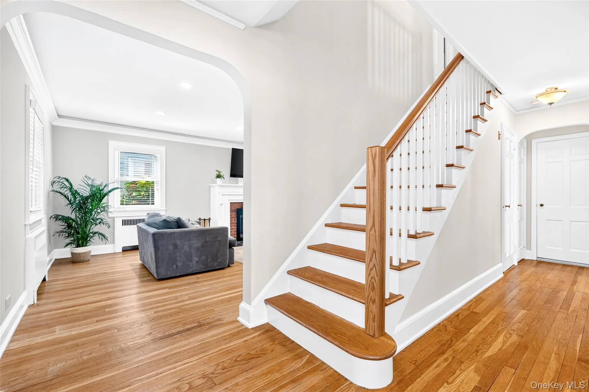 Stairs to second floor and front door entry Stairs to second floor and front door entry