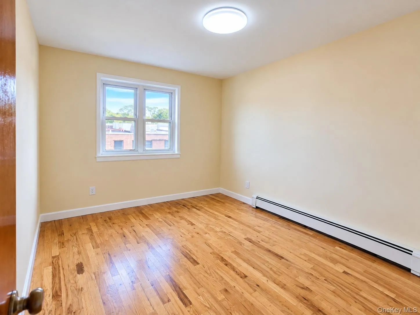 Comfortable bedroom with hardwood floors and abundant natural light. Comfortable bedroom with hardwood floors and abundant natural light.