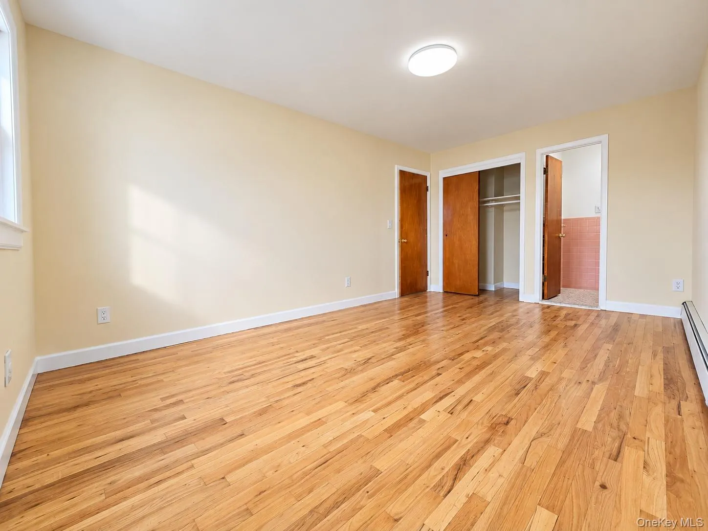 Primary bedroom with generous closet space and private half bath. Primary bedroom with generous closet space and private half bath.