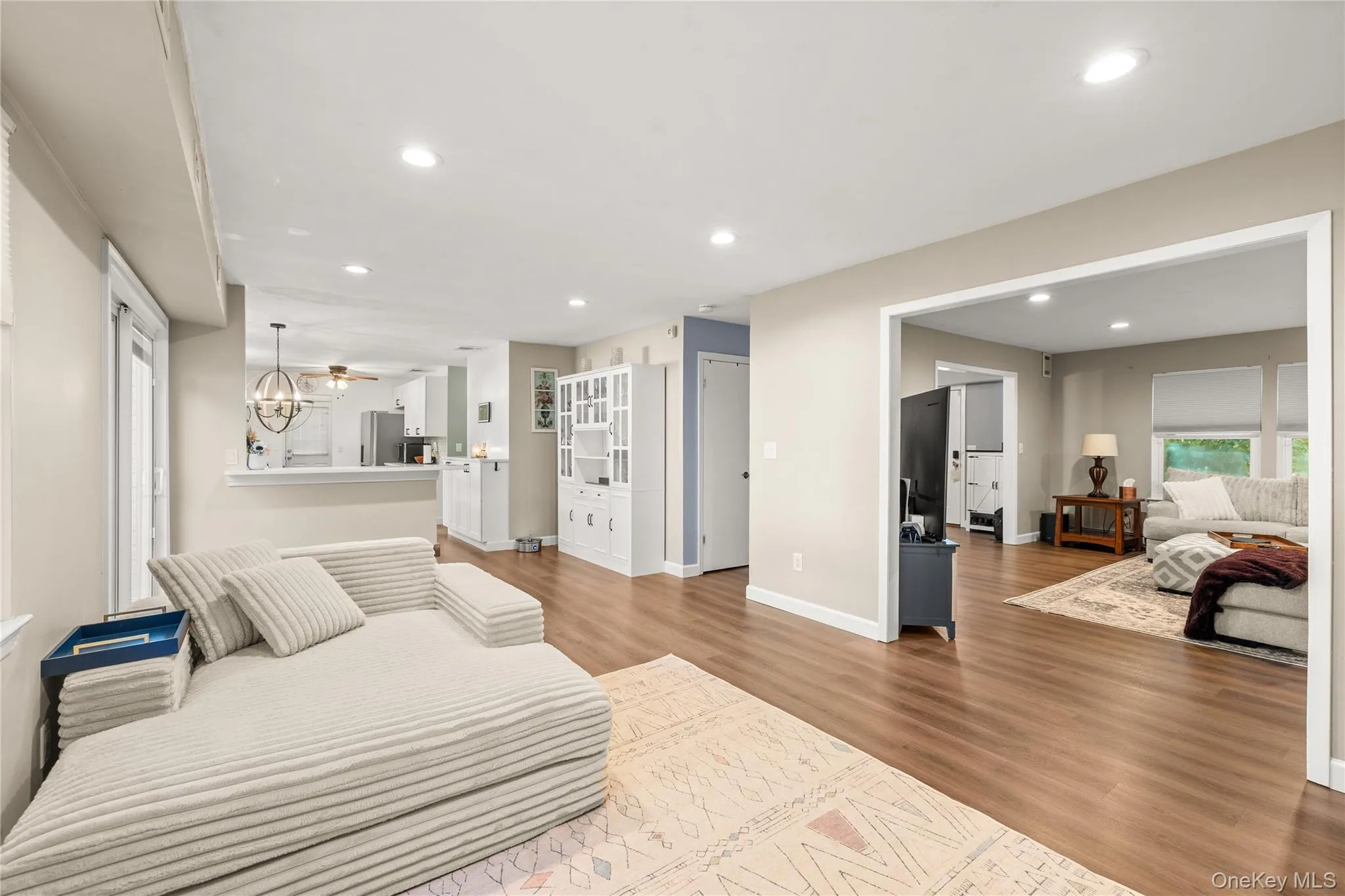 Recessed lighting, wood-finish flooring, light-toned walls. This room is currently set up as a playroom and was virtually staged as a dining room. Recessed lighting, wood-finish flooring, light-toned walls. This room is currently set up as a playroom and was virtually staged as a dining room.