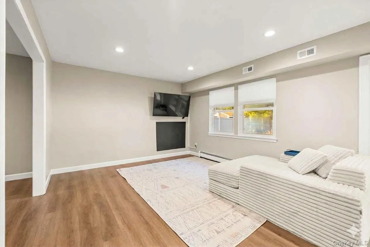 Recessed lighting, wood-finish flooring, light-toned walls. This room is currently set up as a playroom and was virtually staged as a dining room. Recessed lighting, wood-finish flooring, light-toned walls. This room is currently set up as a playroom and was virtually staged as a dining room.
