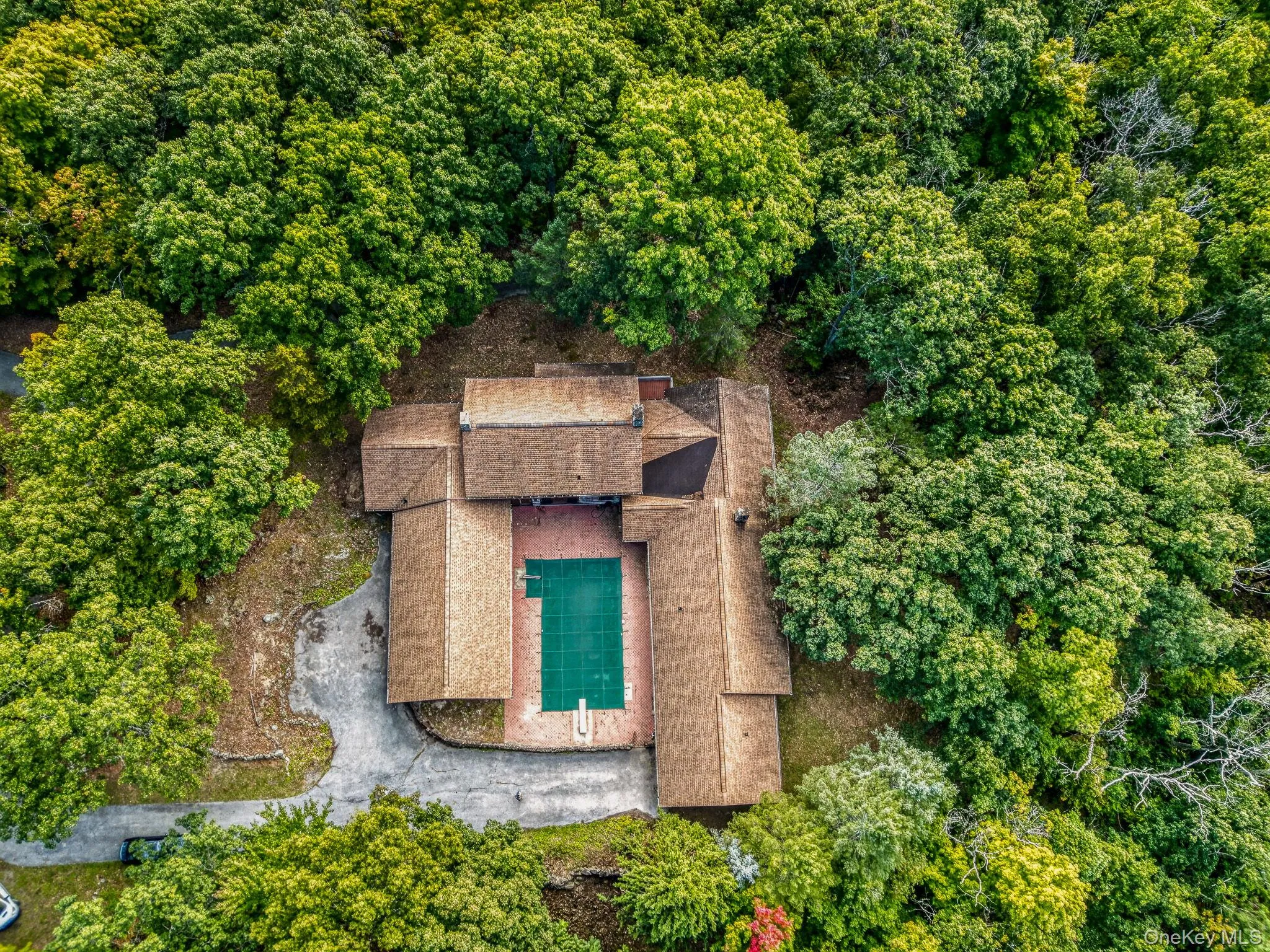 Left side is a three car attached garage. The middle is the main residence. On the right is the secondary residence with one car attached garage. Left side is a three car attached garage. The middle is the main residence. On the right is the secondary residence with one car attached garage.