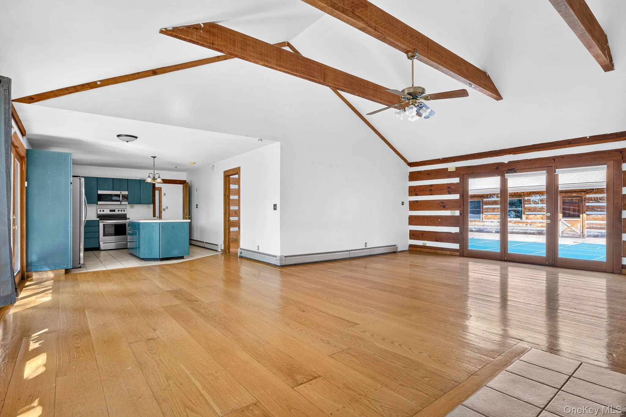 Second residence. Family room to kitchen. Wide plank hardwood floors. Vaulted beamed ceiling. Second residence. Family room to kitchen. Wide plank hardwood floors. Vaulted beamed ceiling.