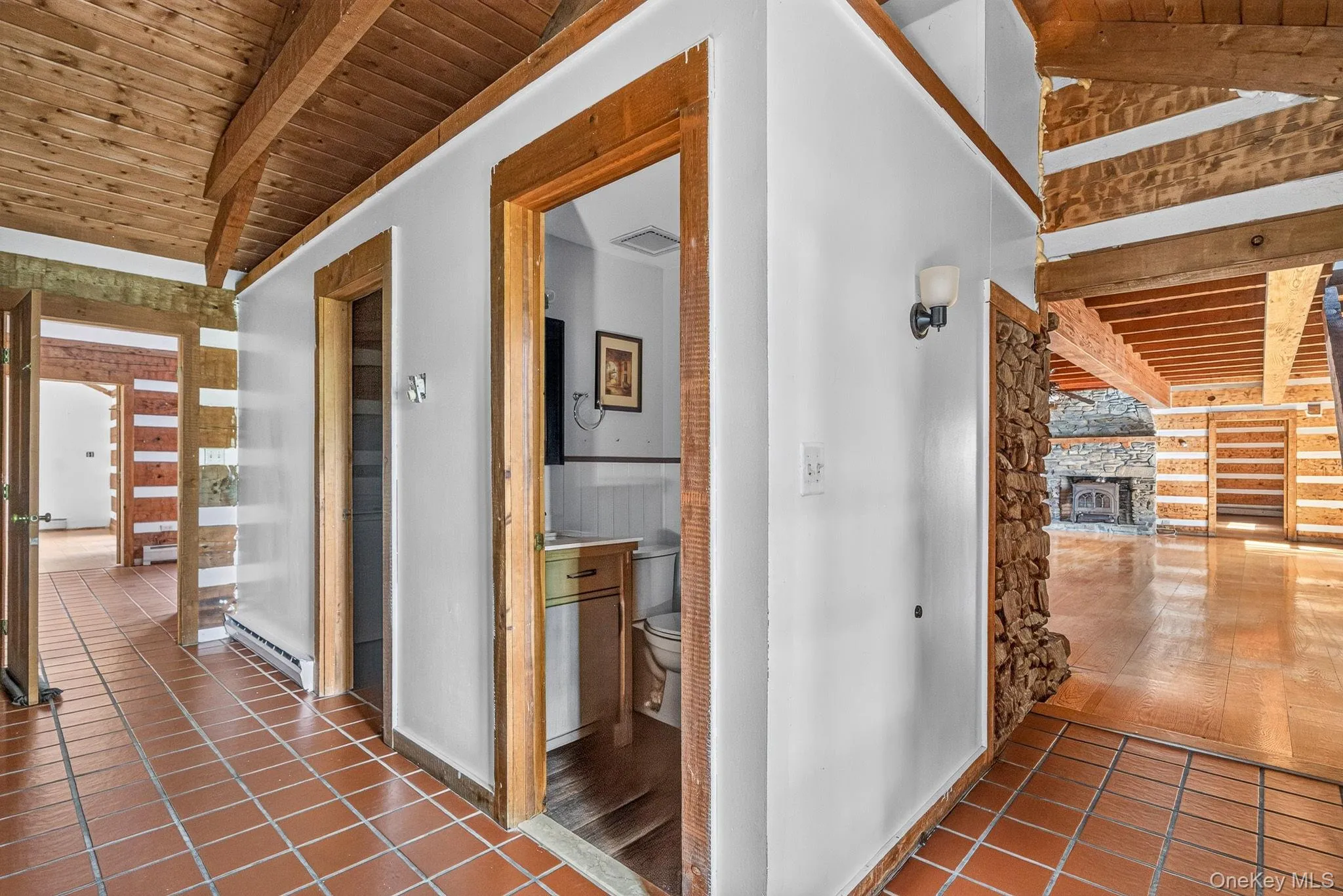 To the right leads to main residence. Straight ahead is an updated half bathroom. Adjacent is a laundry room. Straight ahead leads to residence #2. Game room is across from bathroom. To the right leads to main residence. Straight ahead is an updated half bathroom. Adjacent is a laundry room. Straight ahead leads to residence #2. Game room is across from bathroom.