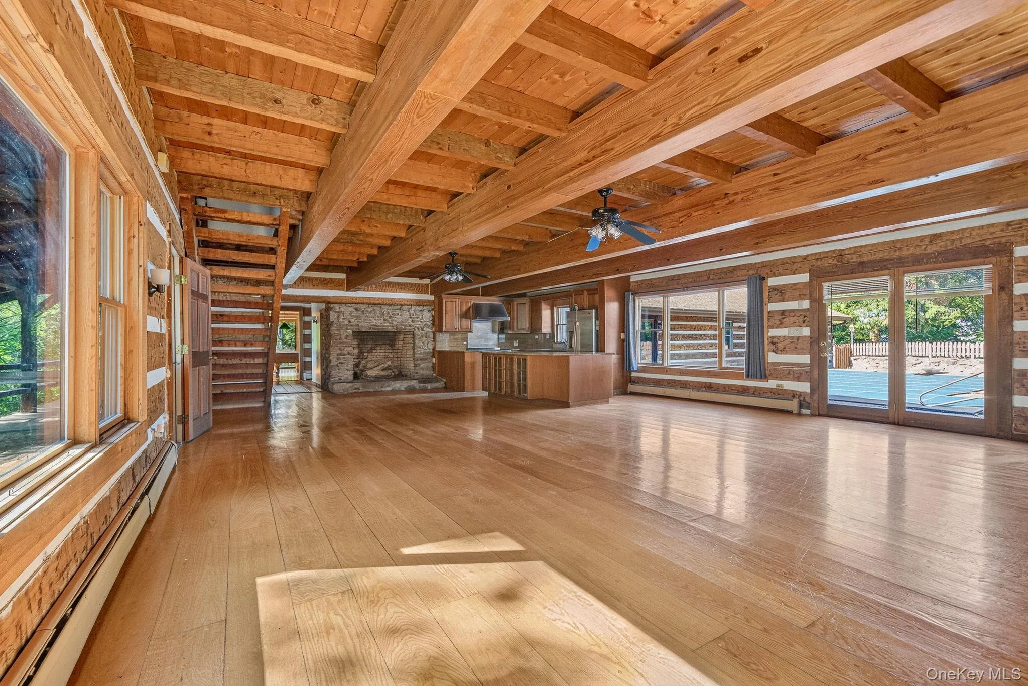 Open family room/dining area/kitchen. Access to front porch and pool courtyard. Open family room/dining area/kitchen. Access to front porch and pool courtyard.