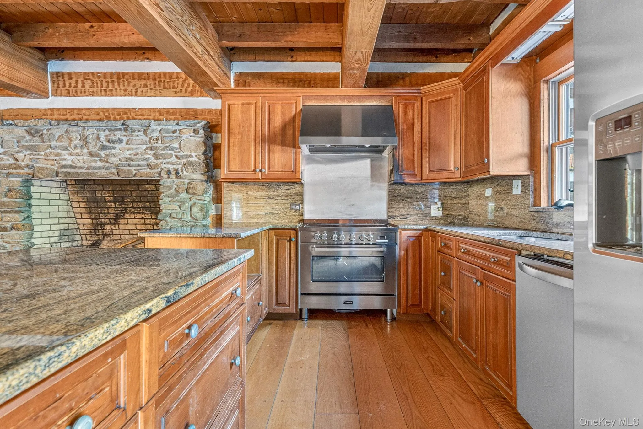 Cherry cabinetry with stainless steel appliances. Cherry cabinetry with stainless steel appliances.