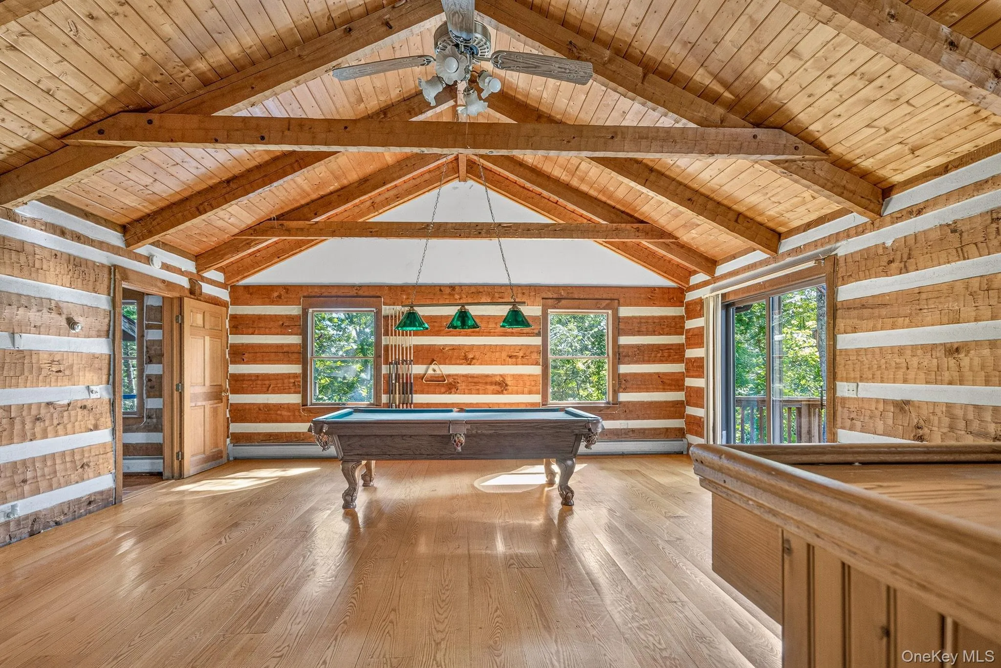 Vaulted beamed ceilings. Wide plank hardwood flooring. Vaulted beamed ceilings. Wide plank hardwood flooring.