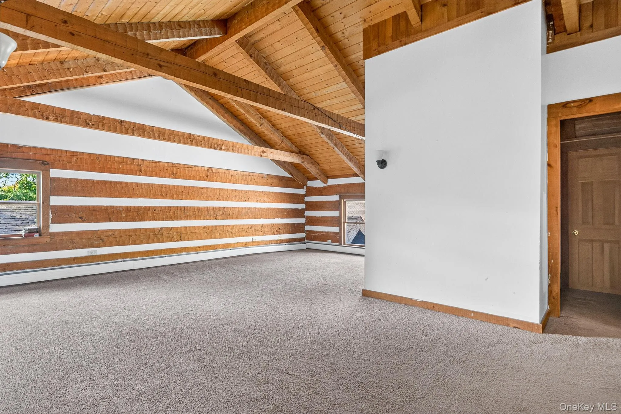 Main residence, second floor lounge area/bonus space. Door leads to full bathroom. Main residence, second floor lounge area/bonus space. Door leads to full bathroom.