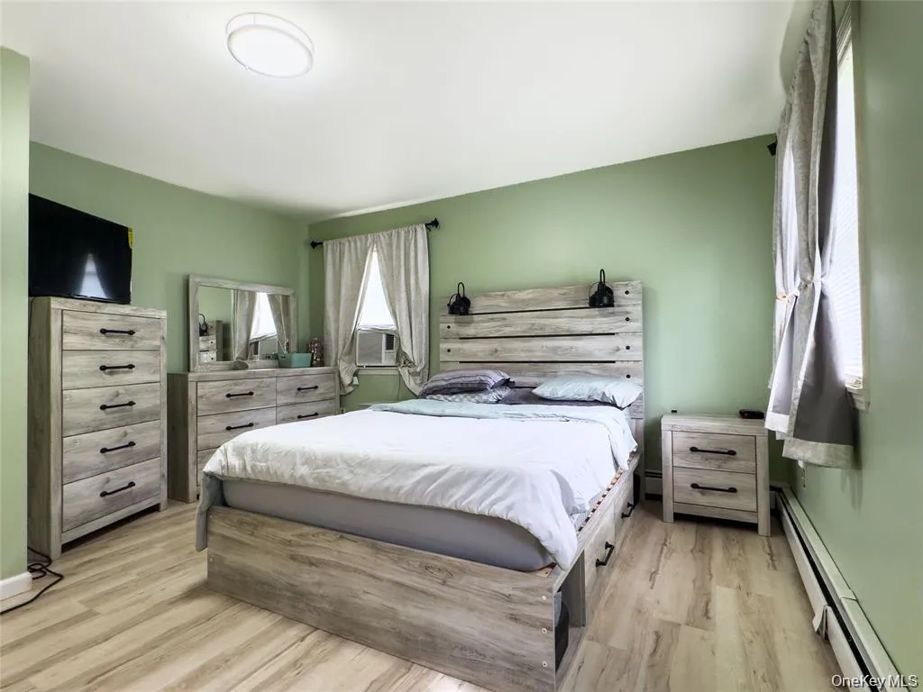 Wood-finish flooring with a flush-mounted ceiling light fixture Wood-finish flooring with a flush-mounted ceiling light fixture