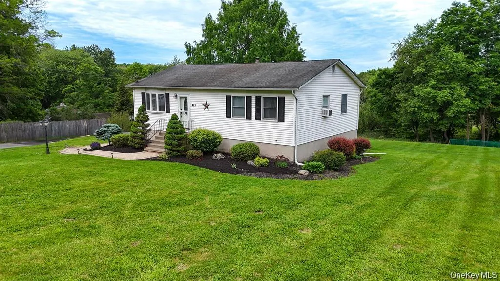 White siding exterior with a dark shingle roof White siding exterior with a dark shingle roof