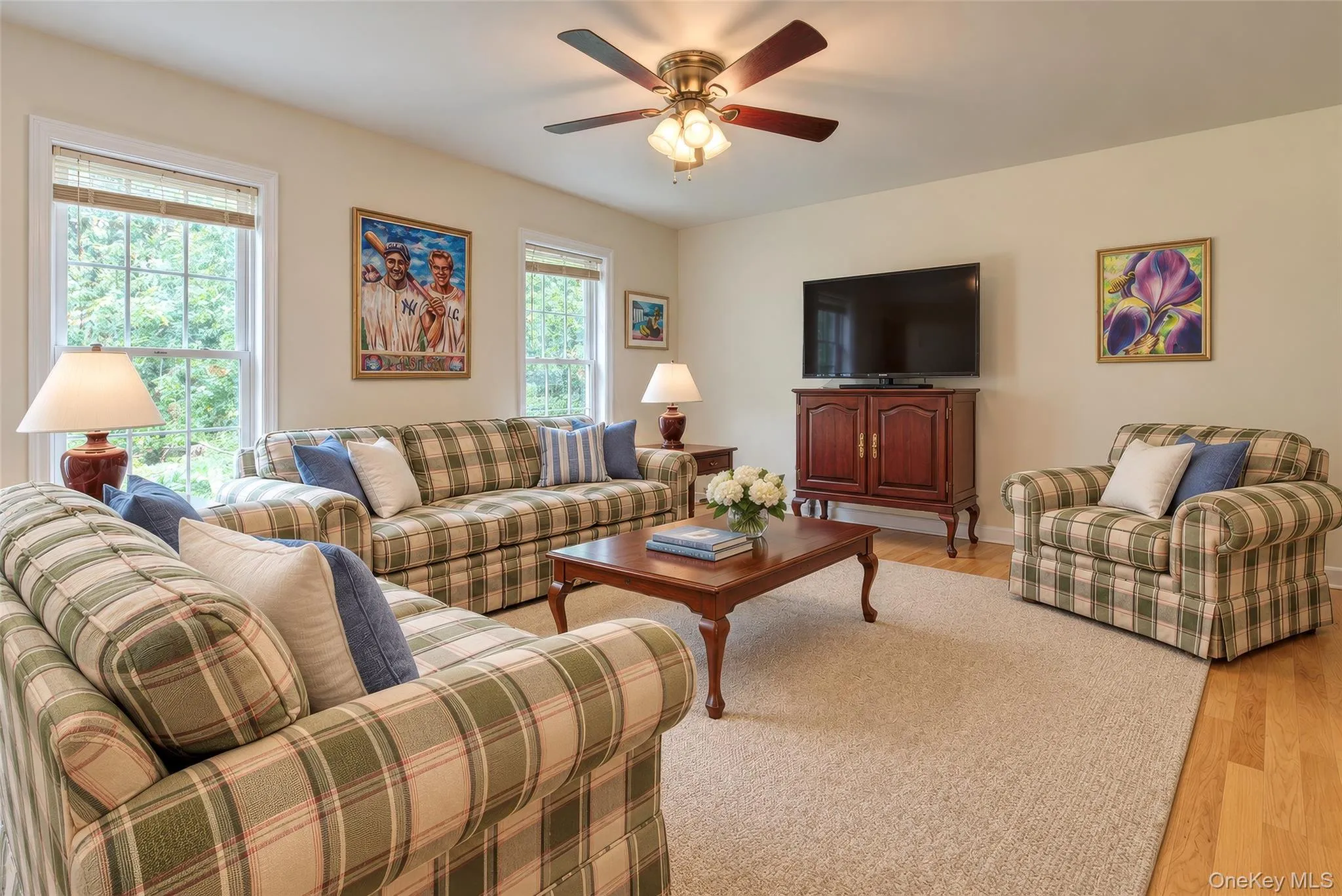 Recessed lighting, wood-finish flooring, and a ceiling fan with integrated lighting Recessed lighting, wood-finish flooring, and a ceiling fan with integrated lighting