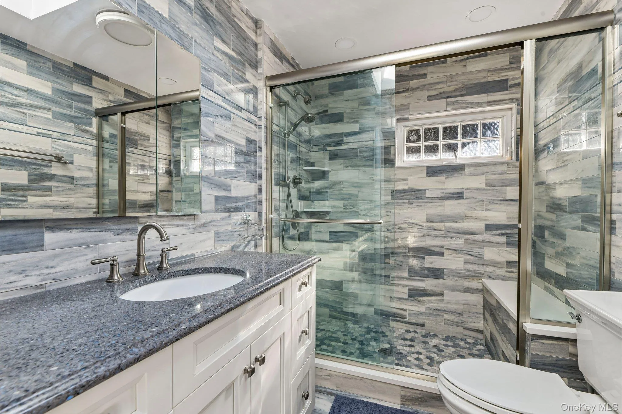 Walk-in shower with seat. Walk-in shower with seat.