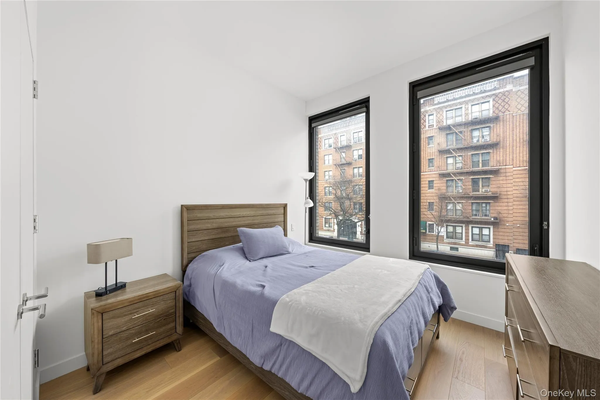 Bedroom featuring light wood finished floors Bedroom featuring light wood finished floors
