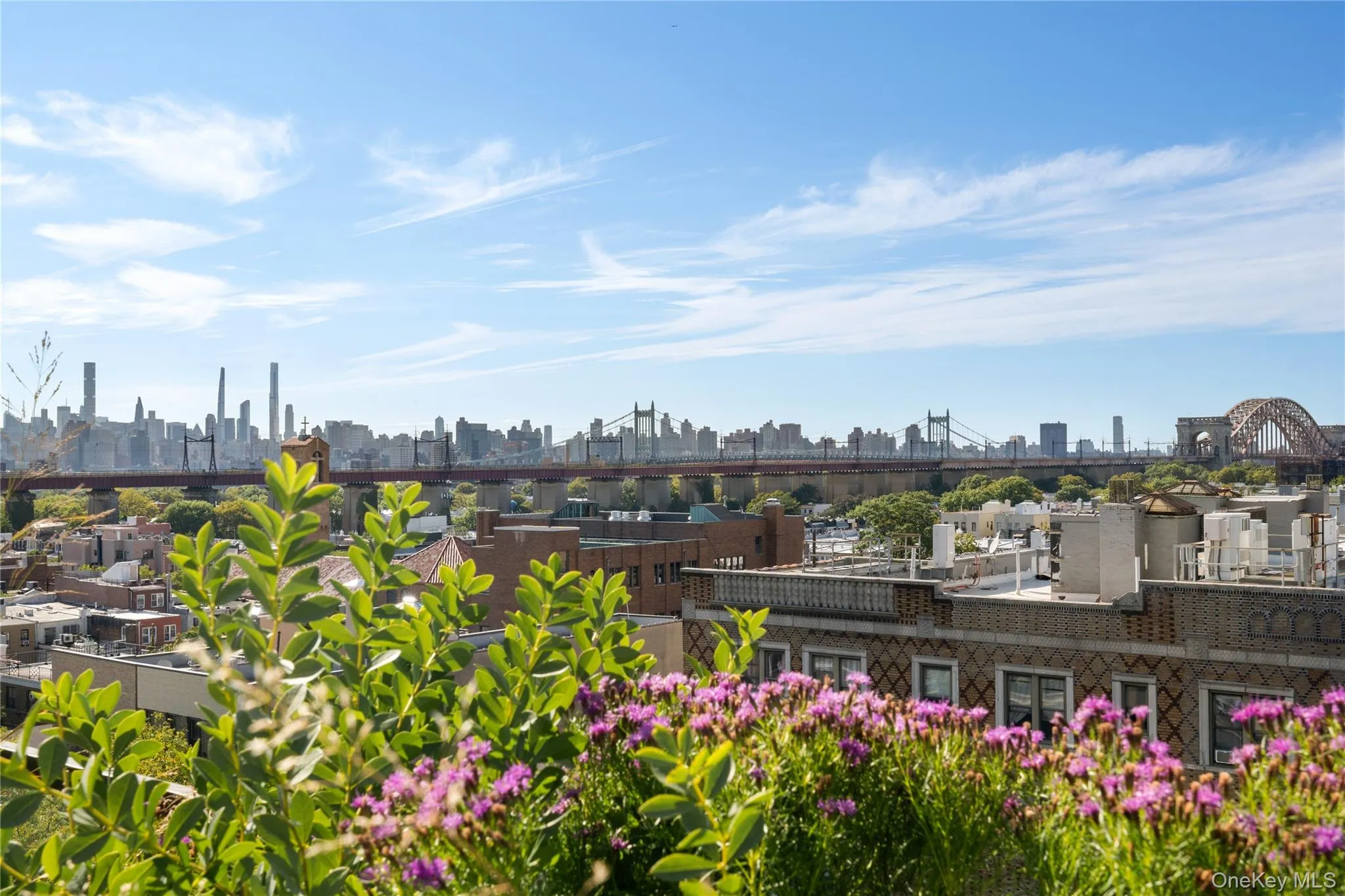View of home's community with a skyline view and a patio area View of home's community with a skyline view and a patio area