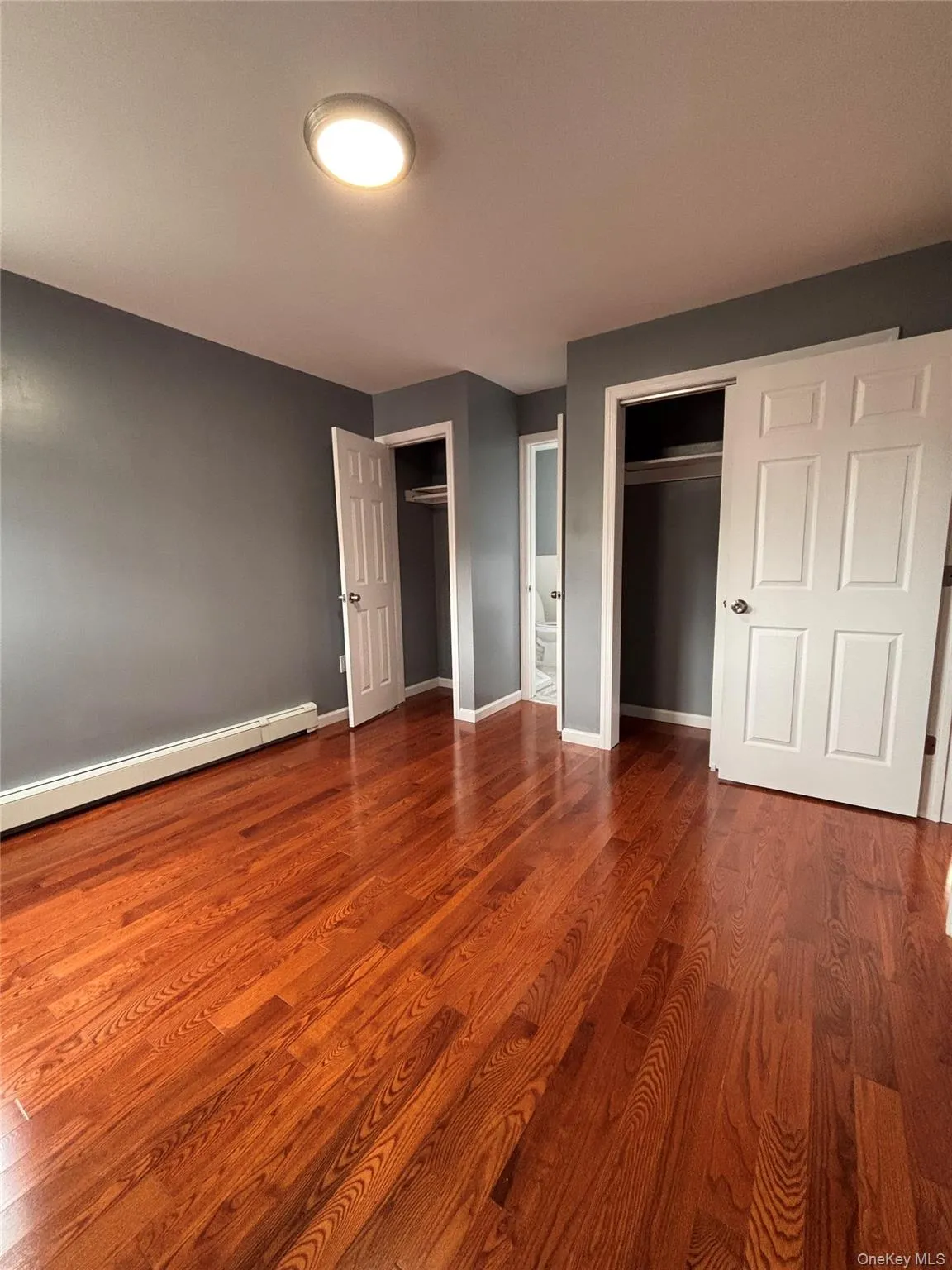 Wood-finish flooring, two closets Wood-finish flooring, two closets