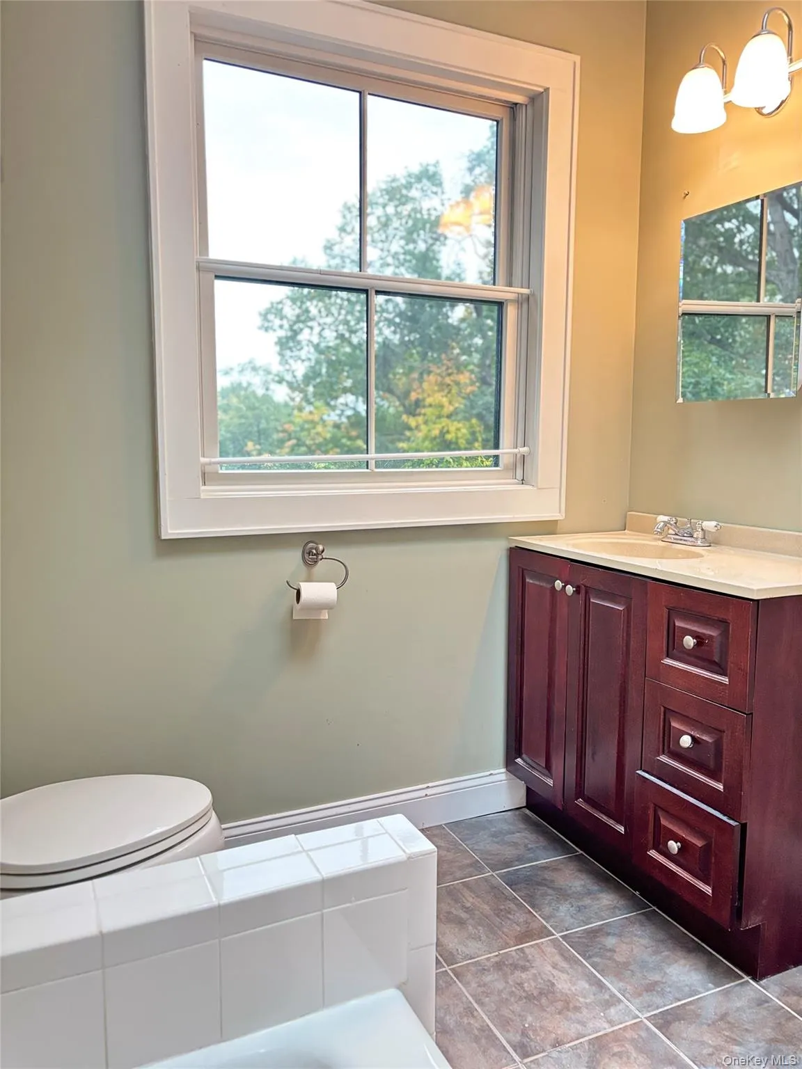 Full bathroom with vanity and lighting Full bathroom with vanity and lighting