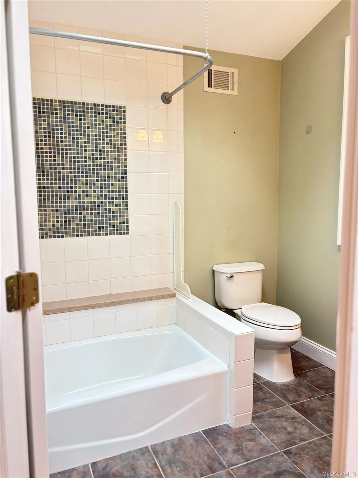 Full bathroom with tiled floors and custom tiled tub/shower Full bathroom with tiled floors and custom tiled tub/shower