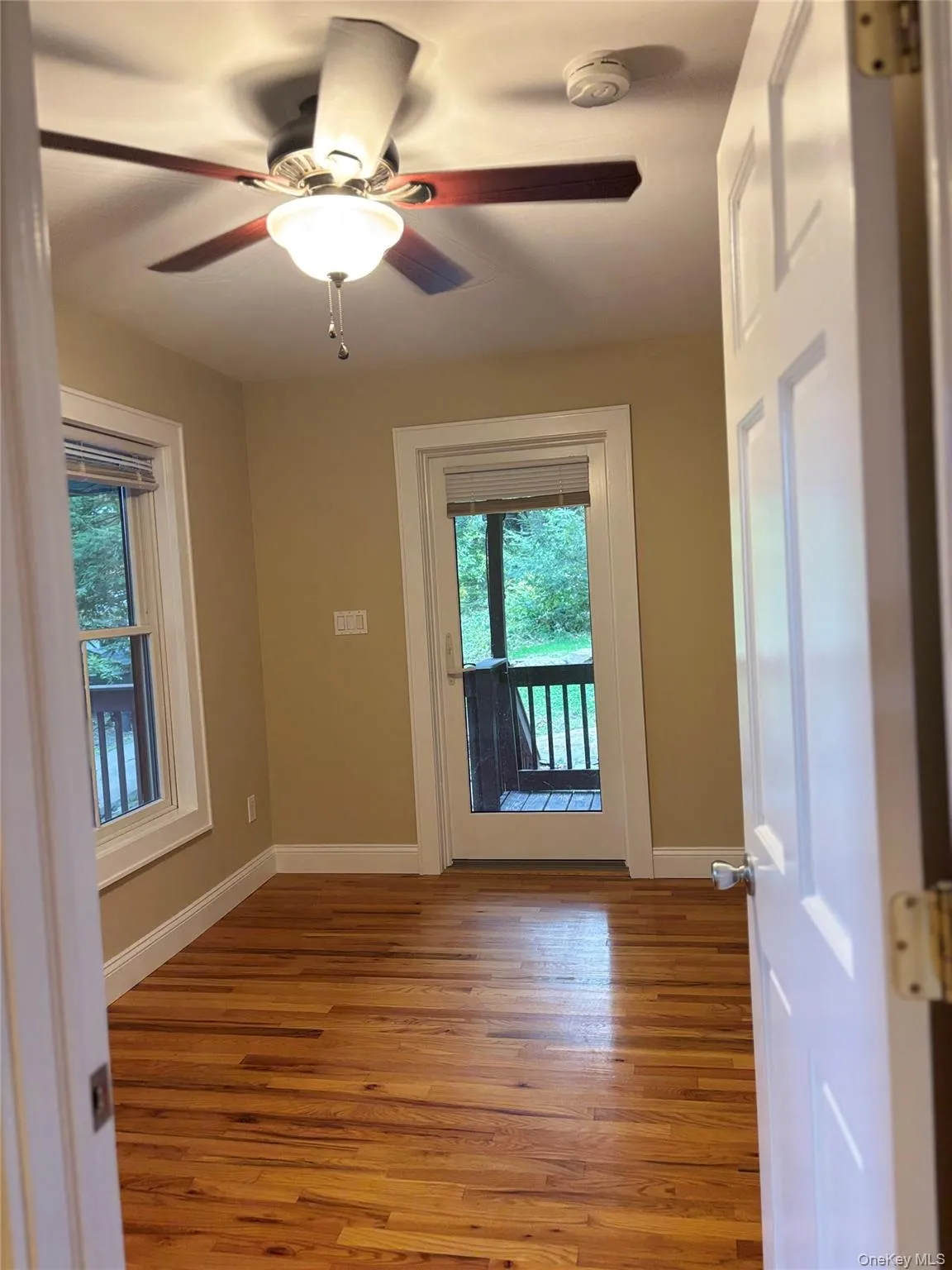 Hardwood floors continue into the first floor bedroom. Hardwood floors continue into the first floor bedroom.