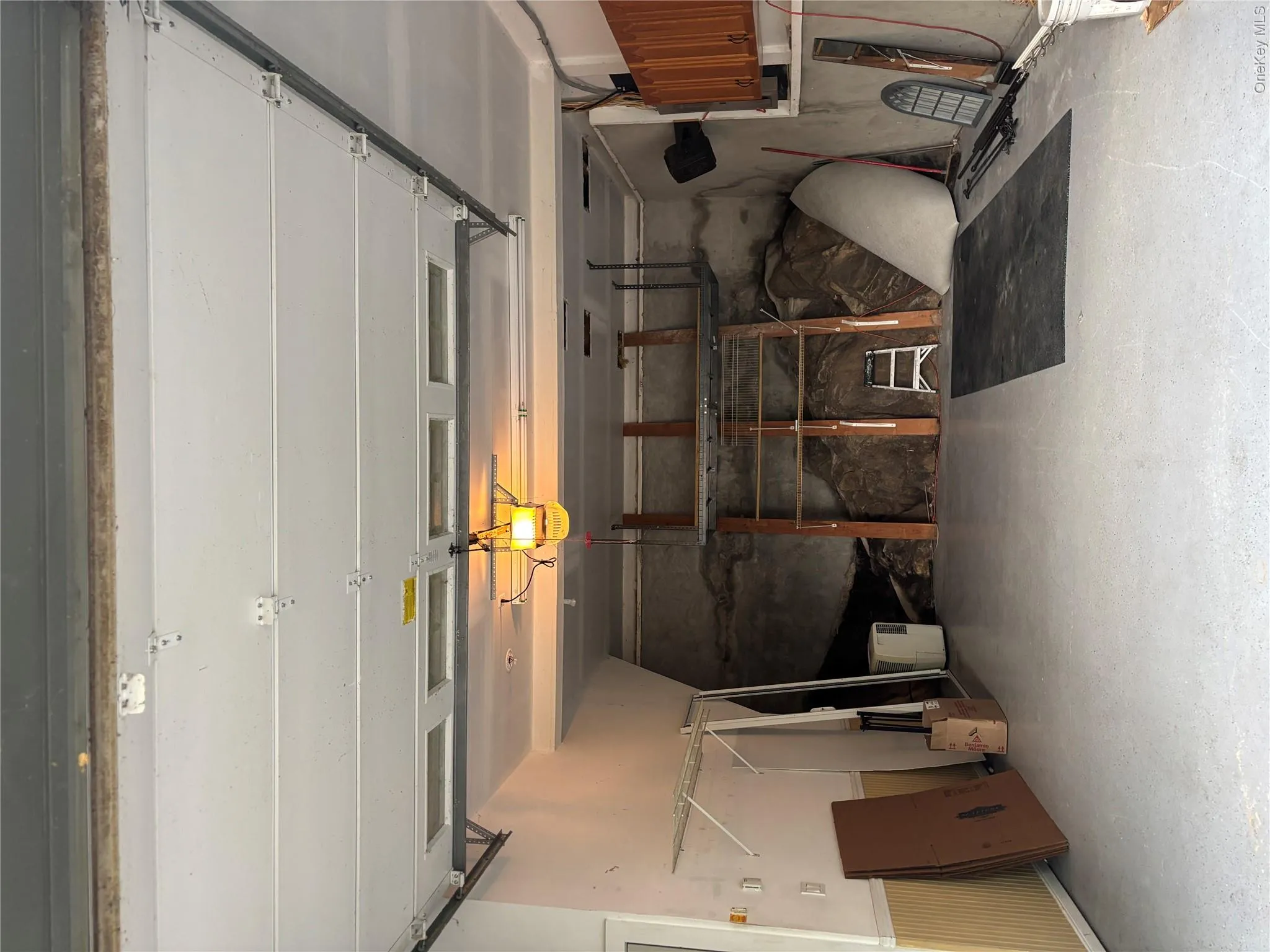Spacious garage can fit your car and has storage cabinetry as well as housing the laundry center. Spacious garage can fit your car and has storage cabinetry as well as housing the laundry center.
