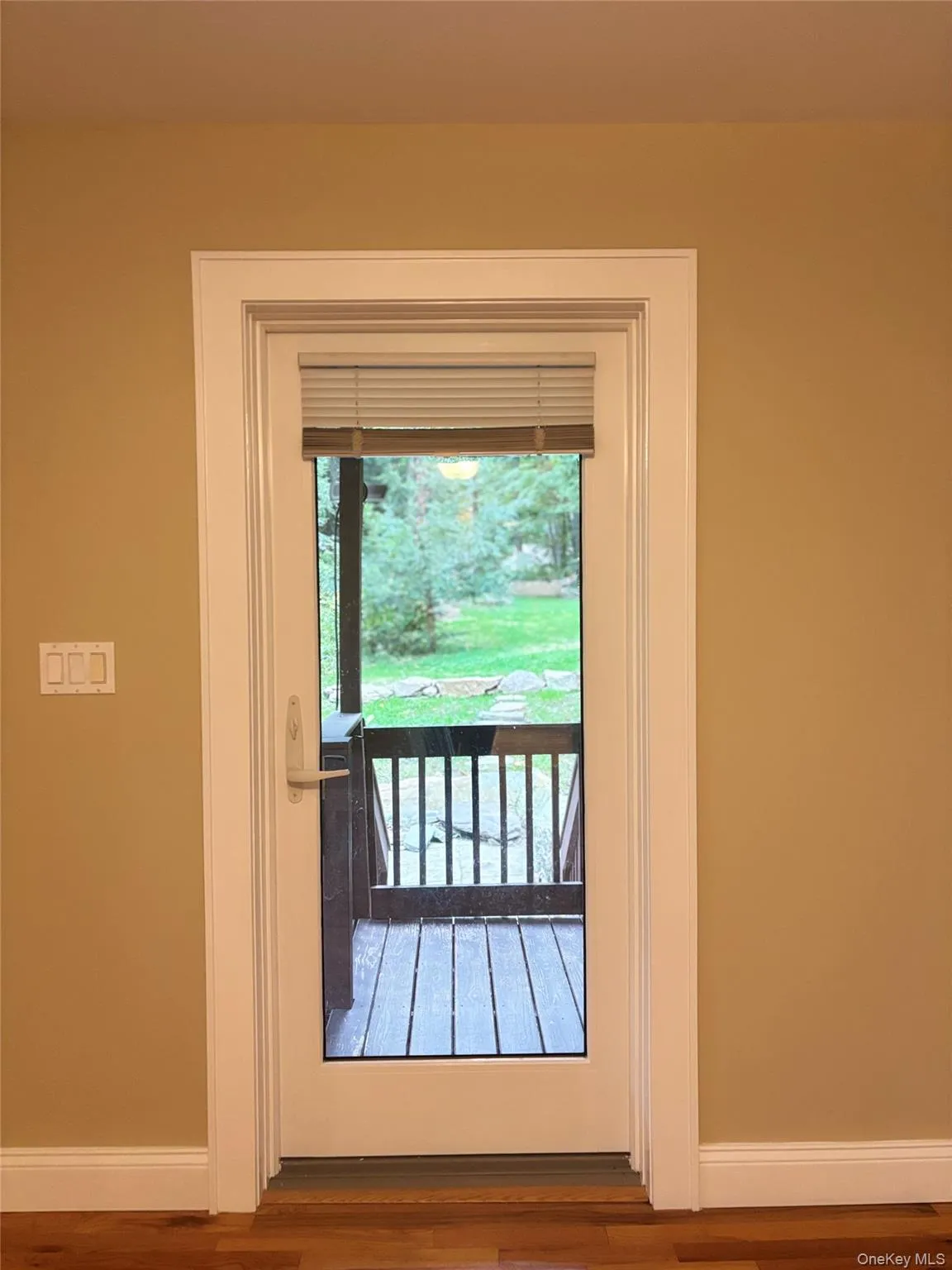 Just off first floor bath a glass-paneled door, leads to an outdoor deck that is perfect for enjoying morning coffee Just off first floor bath a glass-paneled door, leads to an outdoor deck that is perfect for enjoying morning coffee
