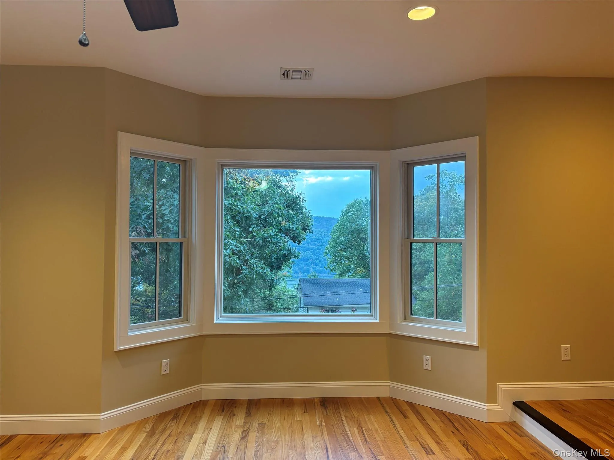 The bay window in the living room, gives you a glimpse of the lake. The bay window in the living room, gives you a glimpse of the lake.