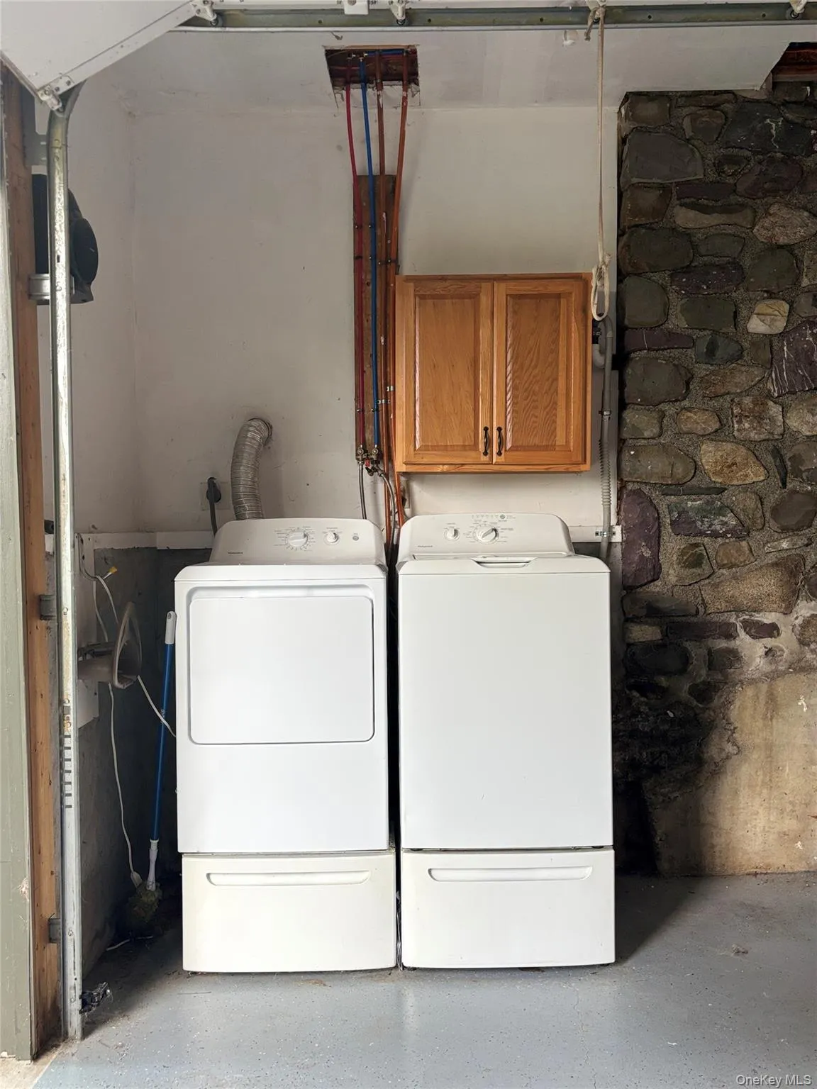 On the lower level of the home in the spacious garage, you can find the laundry as well as room for all of your storage needs. On the lower level of the home in the spacious garage, you can find the laundry as well as room for all of your storage needs.