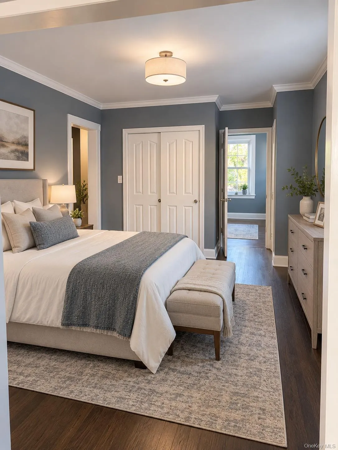 Virtually staged bedroom with double closets, crown moldings and beautiful floors Virtually staged bedroom with double closets, crown moldings and beautiful floors